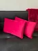 Two red rectangular pillows photo 1