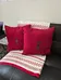 2 red 2 orange pillows photo 5