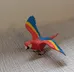 Red, Blue, and Yellow Plastic Parrot Toy photo 1